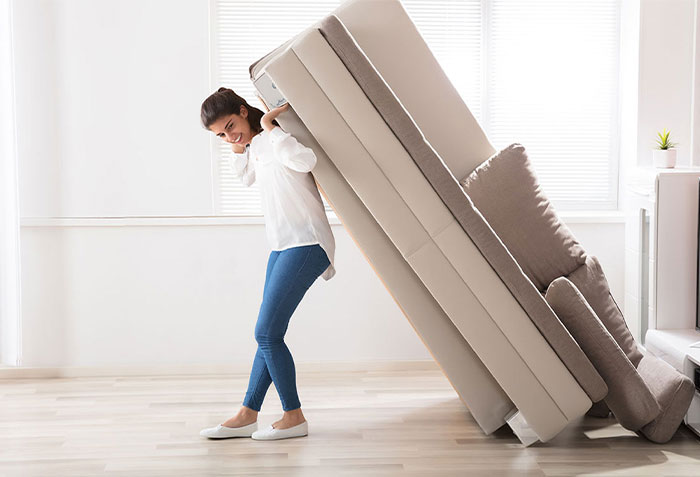 Lady moving sofa | Ronnie's Carpets & Flooring
