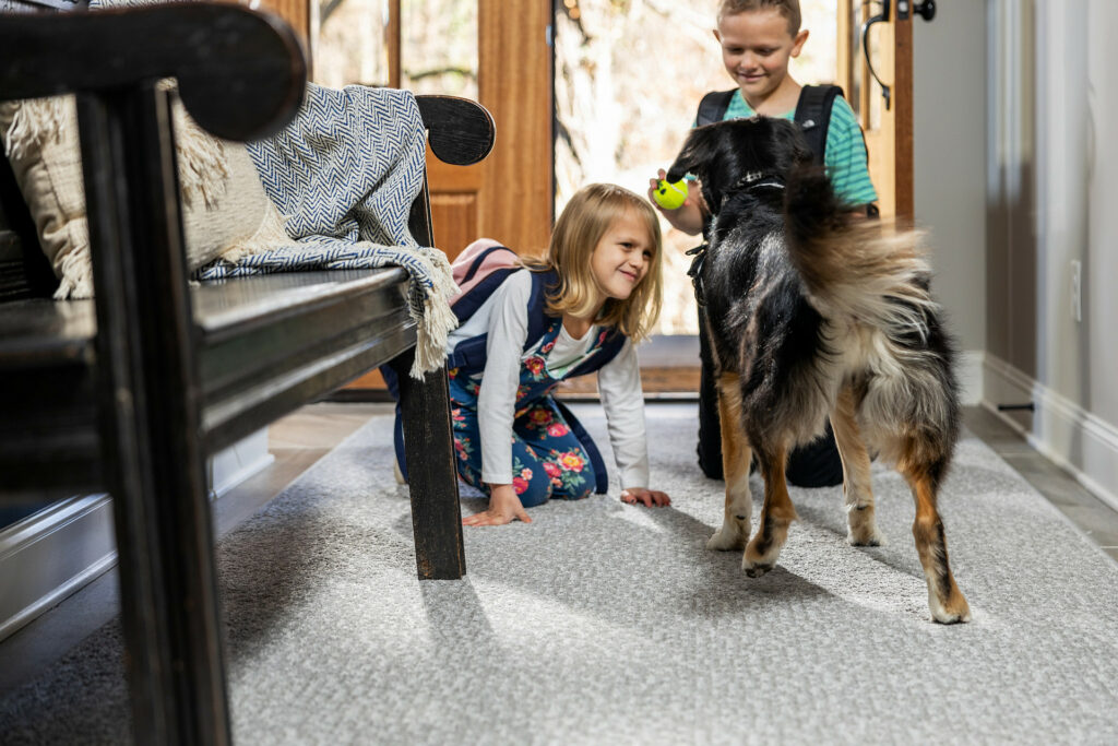 Kids playing with Dog | Ronnie's Carpets & Flooring