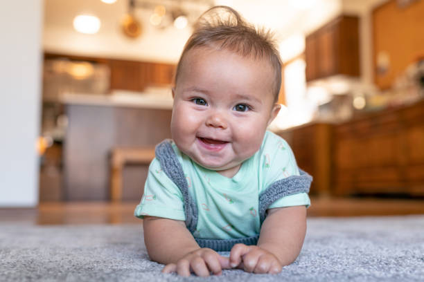 Baby lying on rug | Ronnie's Carpets & Flooring